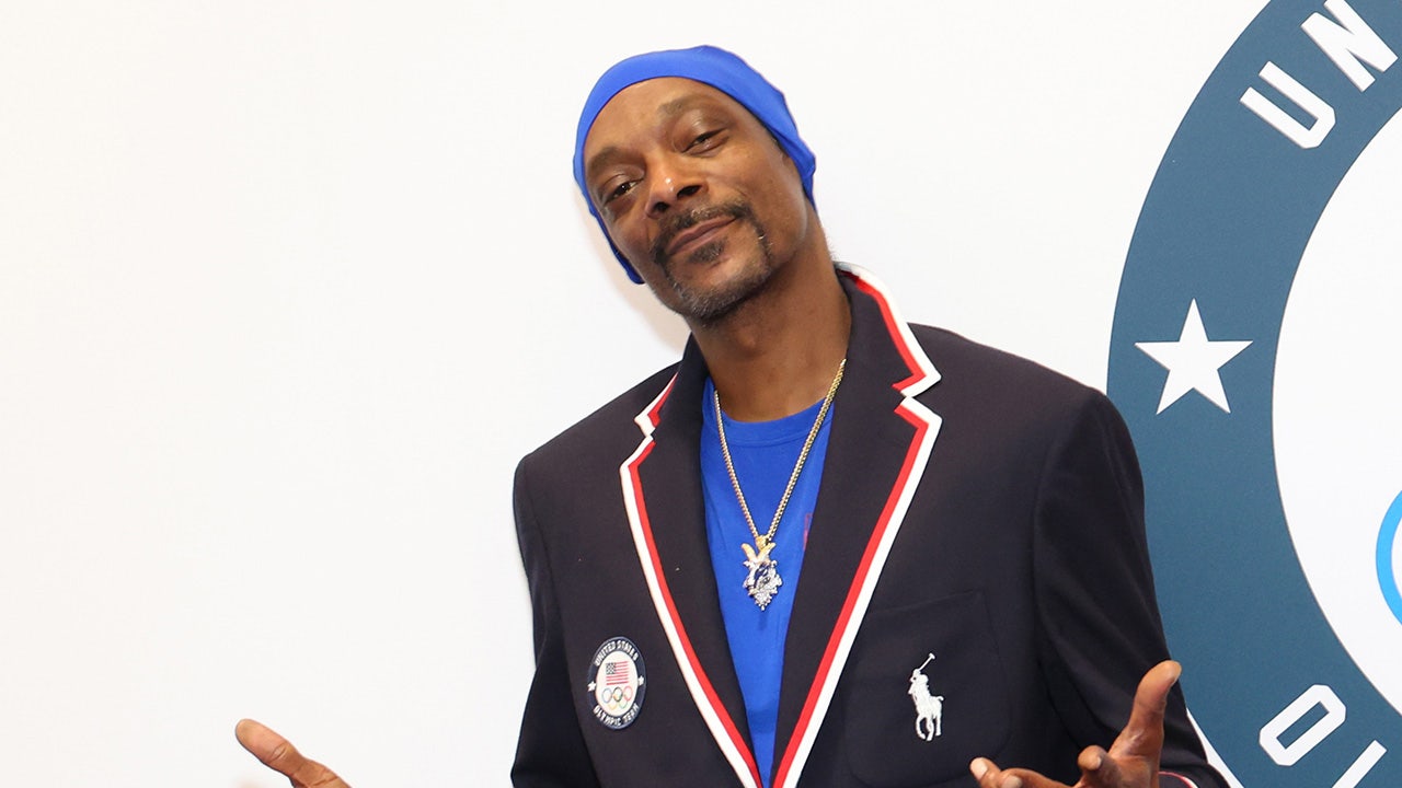 Snoop Dogg celebrates with US swimmer’s wife during gold medal race in