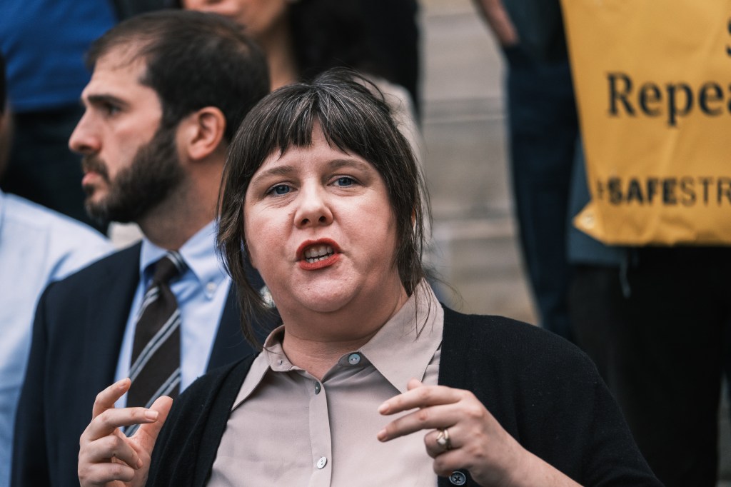 New York State Assemblywoman District 50 Emily Gallagher speaks at a press conferenc