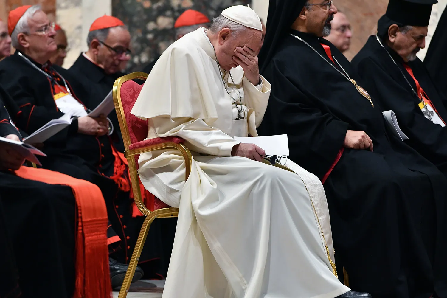 Pope Francis bows his head