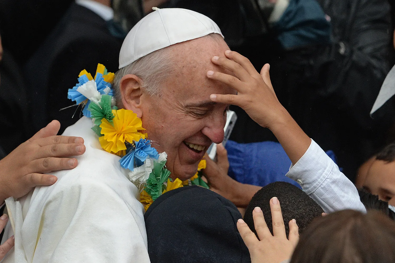 Children reach out to Pope Francis