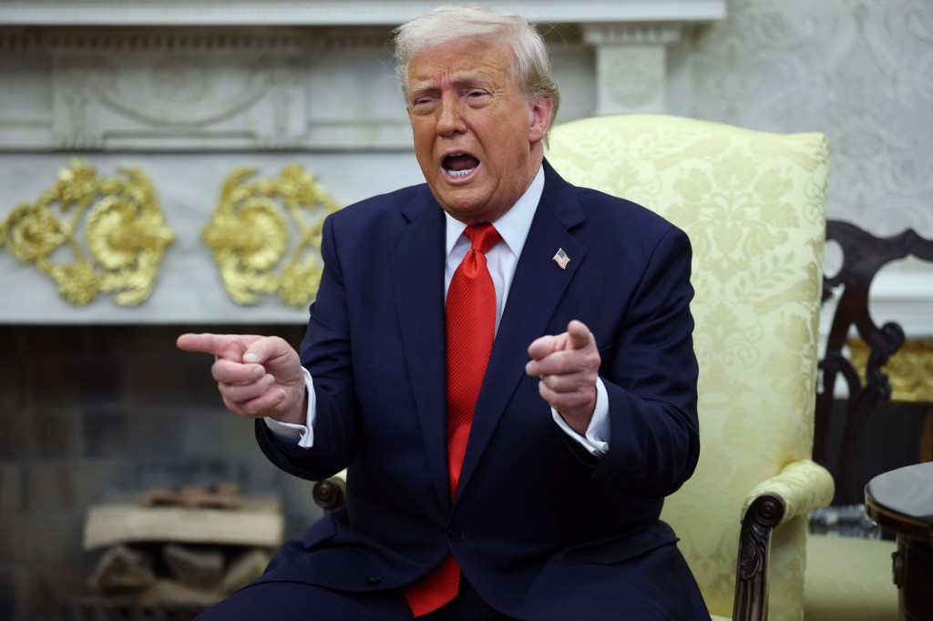 President Donald Trump gesturing during a meeting with El Salvador President Nayib Bukele in the Oval Office of the White House