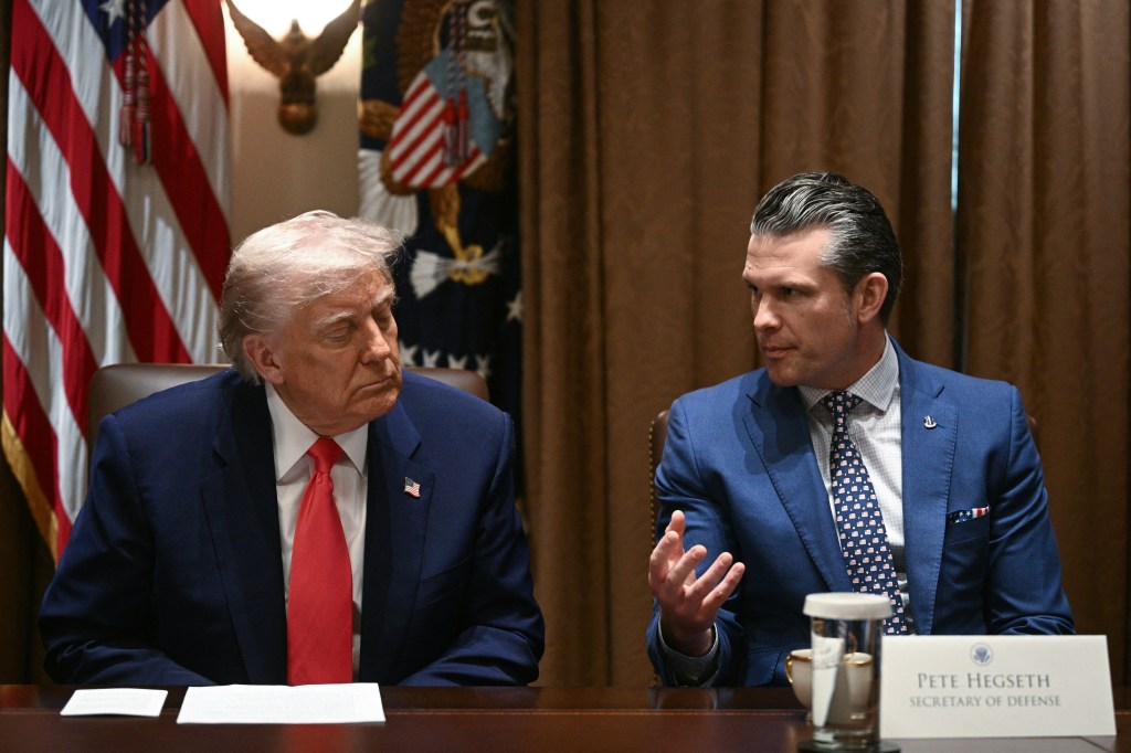 President Donald Trump looks on as Secretary of Defense Pete Hegseth speaks during a cabinet meeting in the Cabinet Room of the White House on April 10, 2025, in Washington, DC. 