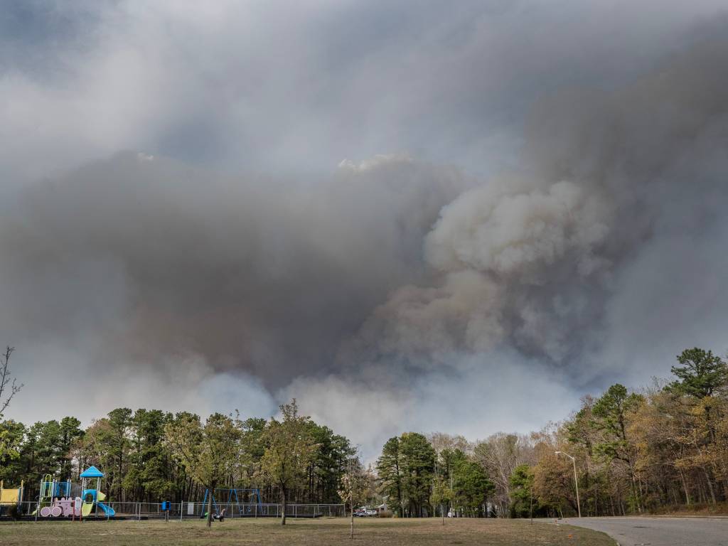 Smoke billowing from a forest fire in the Barnegat/Waretown area, viewed from a playground on First Ave