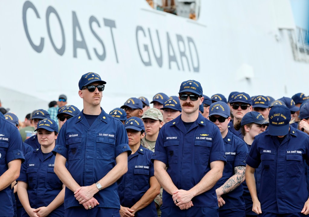 Members of the U.S. Coast Guard from cutter James awaiting the arrival of U.S. Attorney General Pam Bondi and FBI Director Kash Patel for a news conference at Port Everglades, Florida