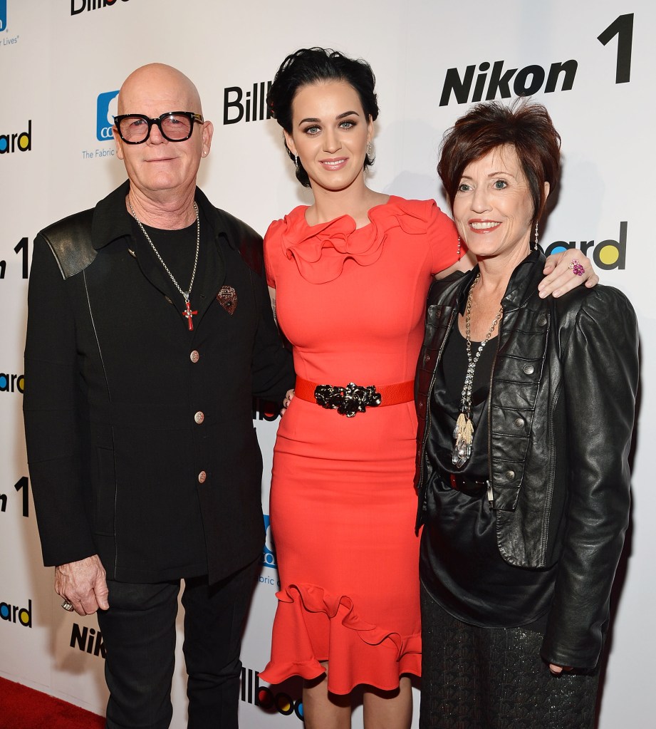 A photo of Katy Perry standing between her parents.