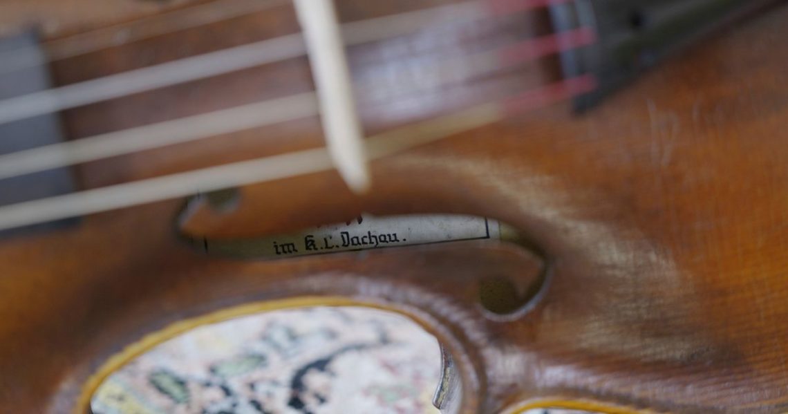 A secret note hidden in Dachau-built ‘Violin of Hope’ tells a tale of survival and craftsmanship