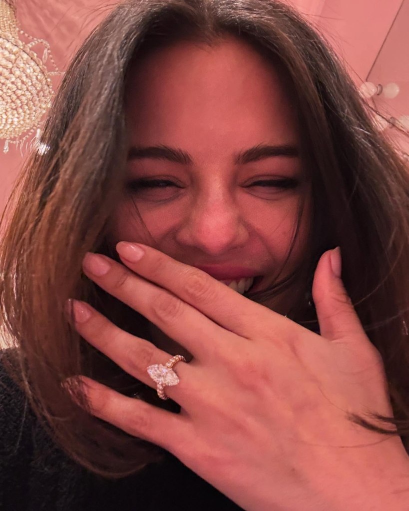 Selena Gomez showing off her engagement ring. 