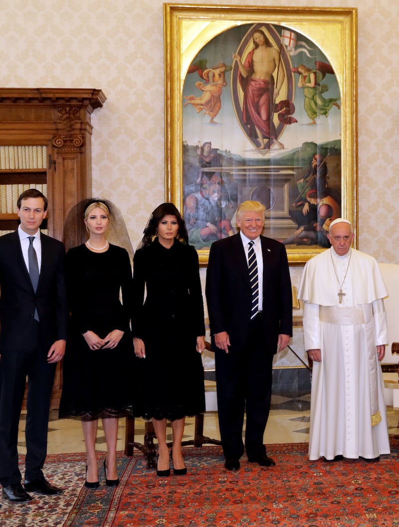 Pope Francis poses with Donald Trump and family in 2017. A cropped version of the photo went viral at the time because of the contrast between the men’s dress and facial expressions.
