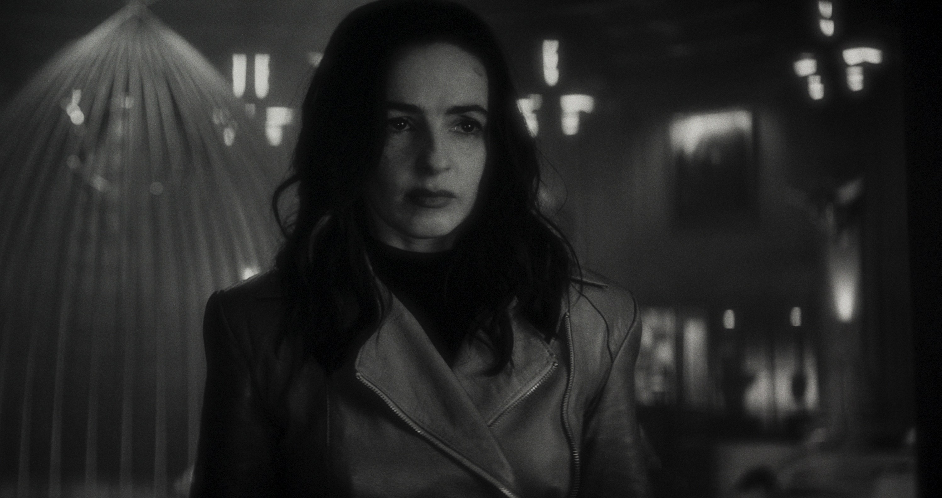 Laura Donnelly looms into frame looking grim as Elsa Bloodstone in Werewolf By Night