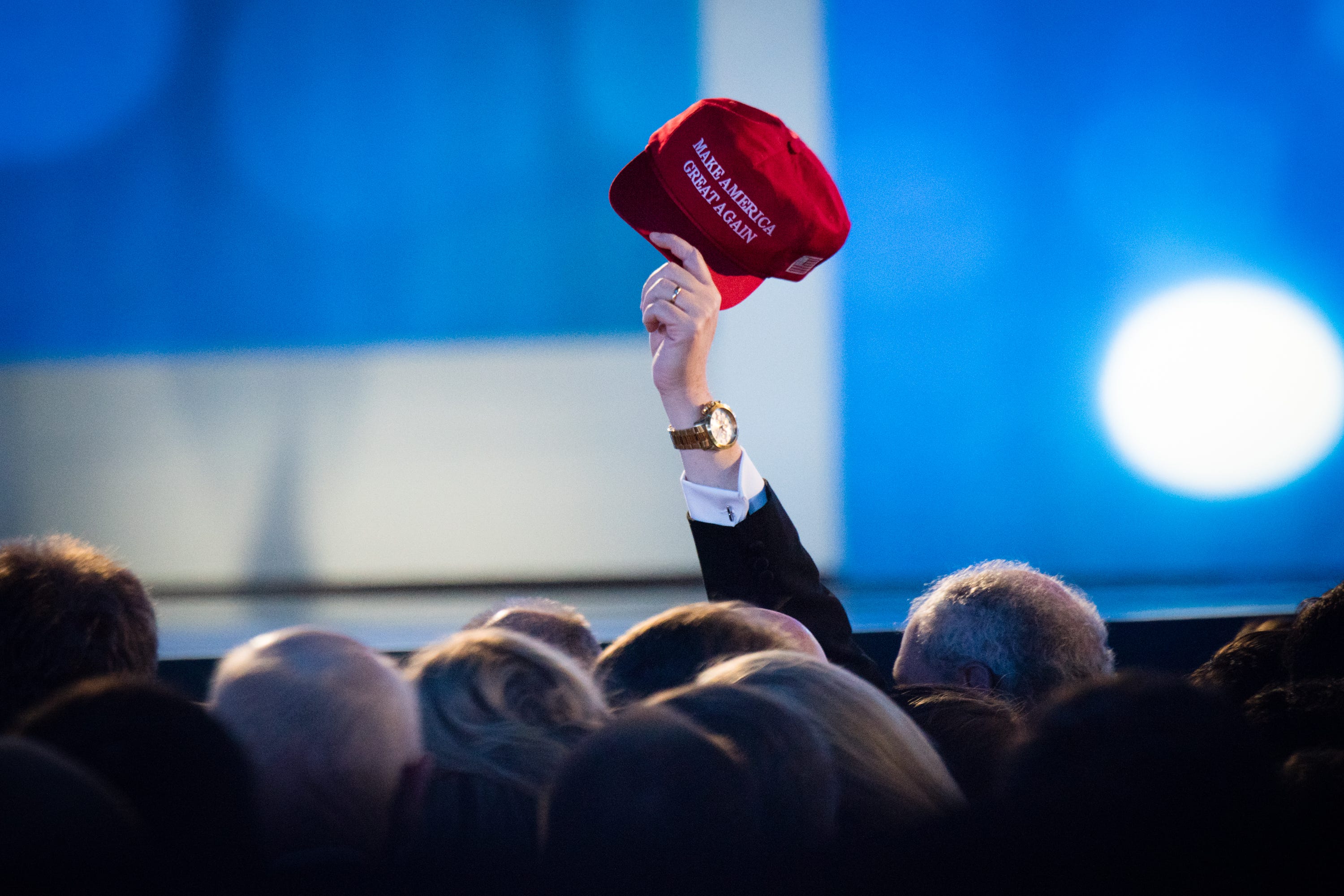 Someone holding MAGA hat