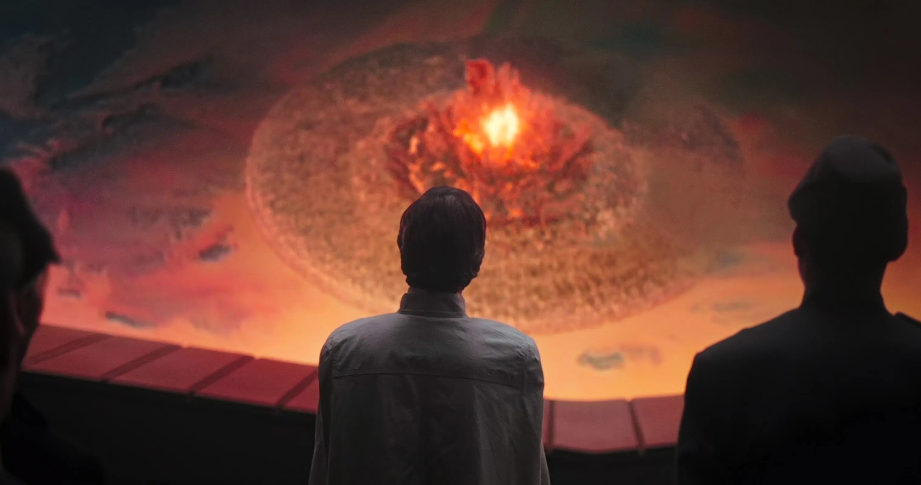 Orson Krennic watching from the death star as a devastating explosion rocks the surface of jedha  in rogue one