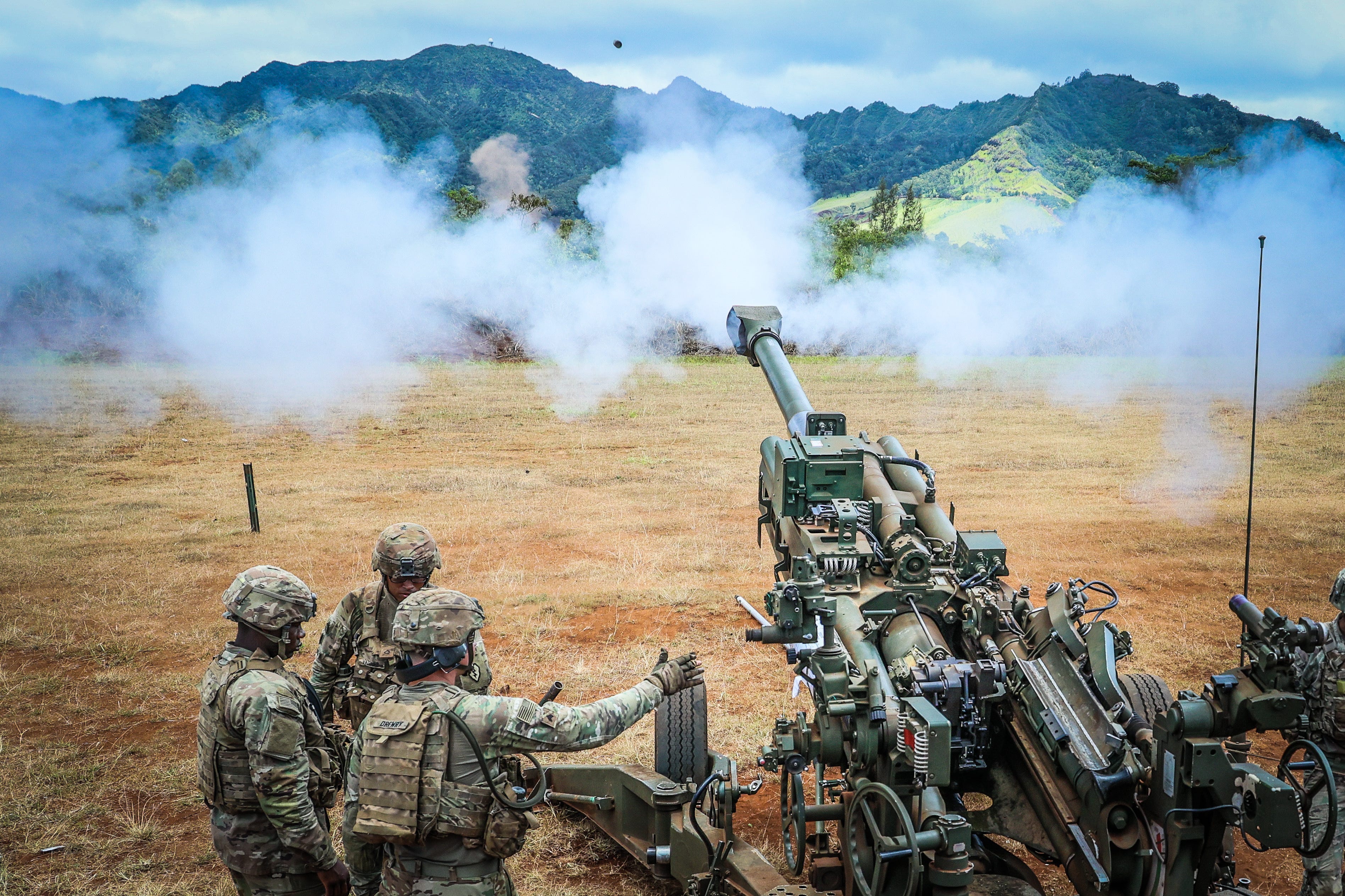 US Army soldiers fire an M777 towed howitzer during live-fire drills in Hawaii in June 2021.