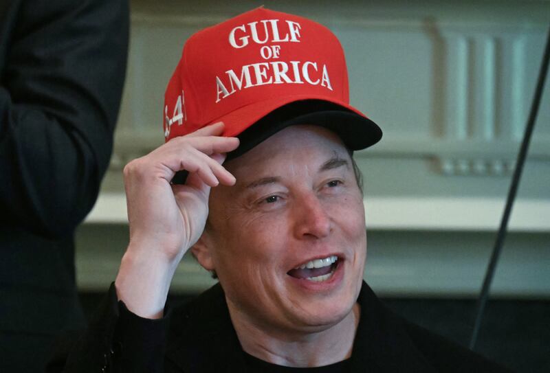 Elon Musk, wearing two hats, bids farewell to top Trump officials at a Cabinet meeting on April 30, 2025 as he feels Washington.