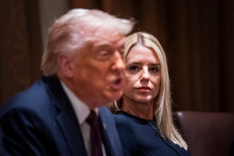 President Donald Trump, flanked by Attorney General Pam Bondi, speaks during a cabinet meeting at the White House on Monday, March 24.