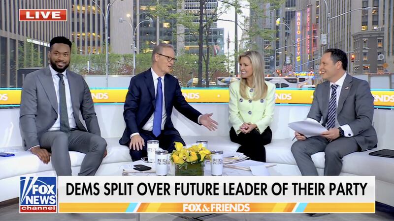 Lawrence Jones looks awkward as Kilmeade makes the gag about asking AOC out.