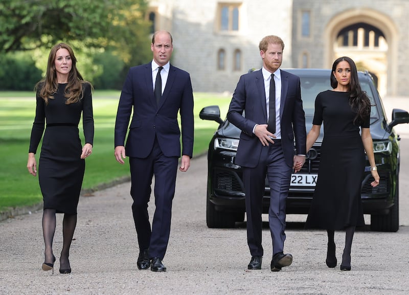 Catherine, Princess of Wales, Prince William, Prince of Wales, Prince Harry, Duke of Sussex, and Meghan, Duchess of Sussex arrive to view flowers and tributes to HM Queen Elizabeth II.