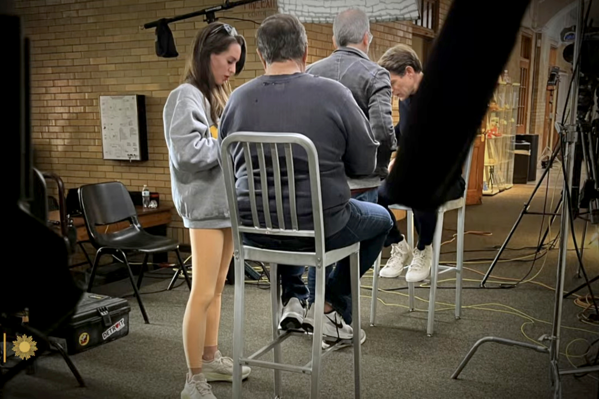 Bill Belichick and Jordon Hudson on the set of an interview. 