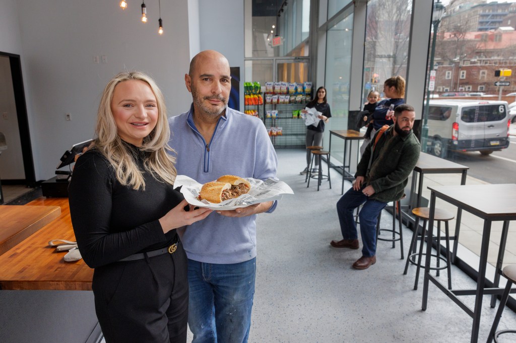 Common Pleas Court Judge Scott DiClaudio poses with his wife Jackee at their new Shay's Cheesesteaks in Philadelphia, Friday, Feb. 23, 2024.