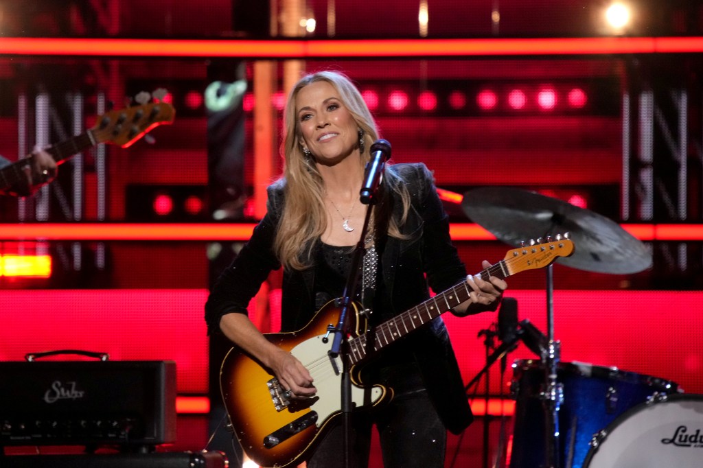 Sheryl Crow performing onstage at the 38th Annual Rock & Roll Hall Of Fame Induction Ceremony in New York City