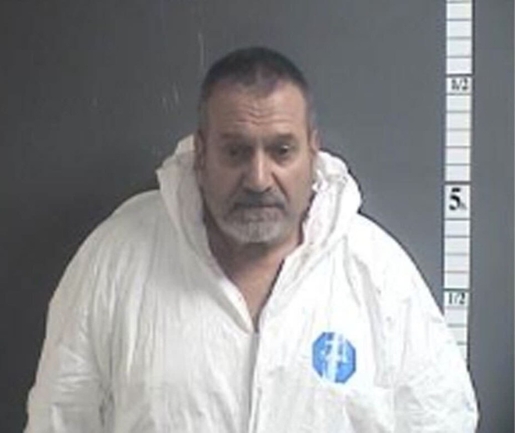 Eric Hannah and his son were arrested and charged with homicide and weapons offenses on April 21.
