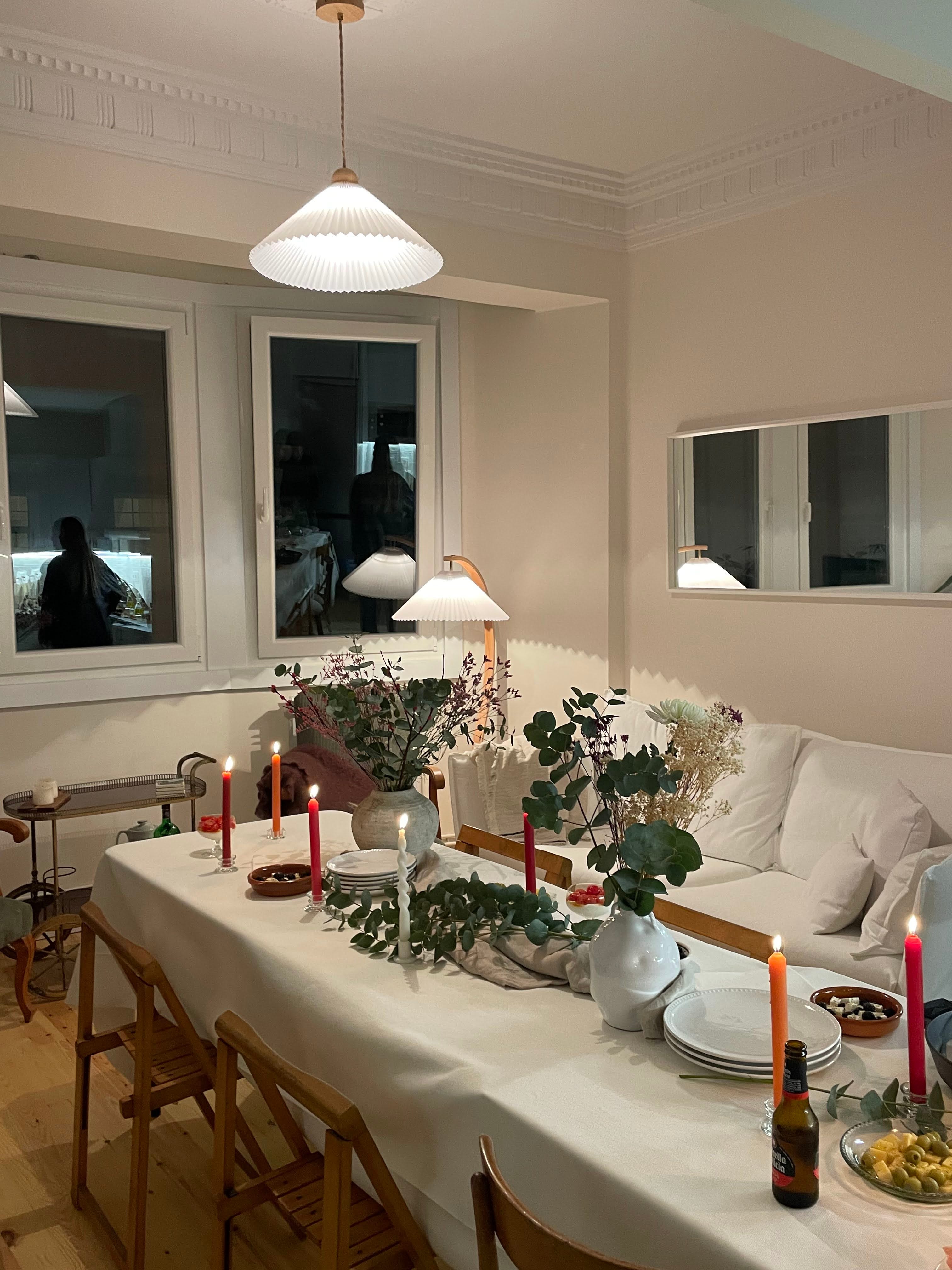 The interior of an apartment with a set table.