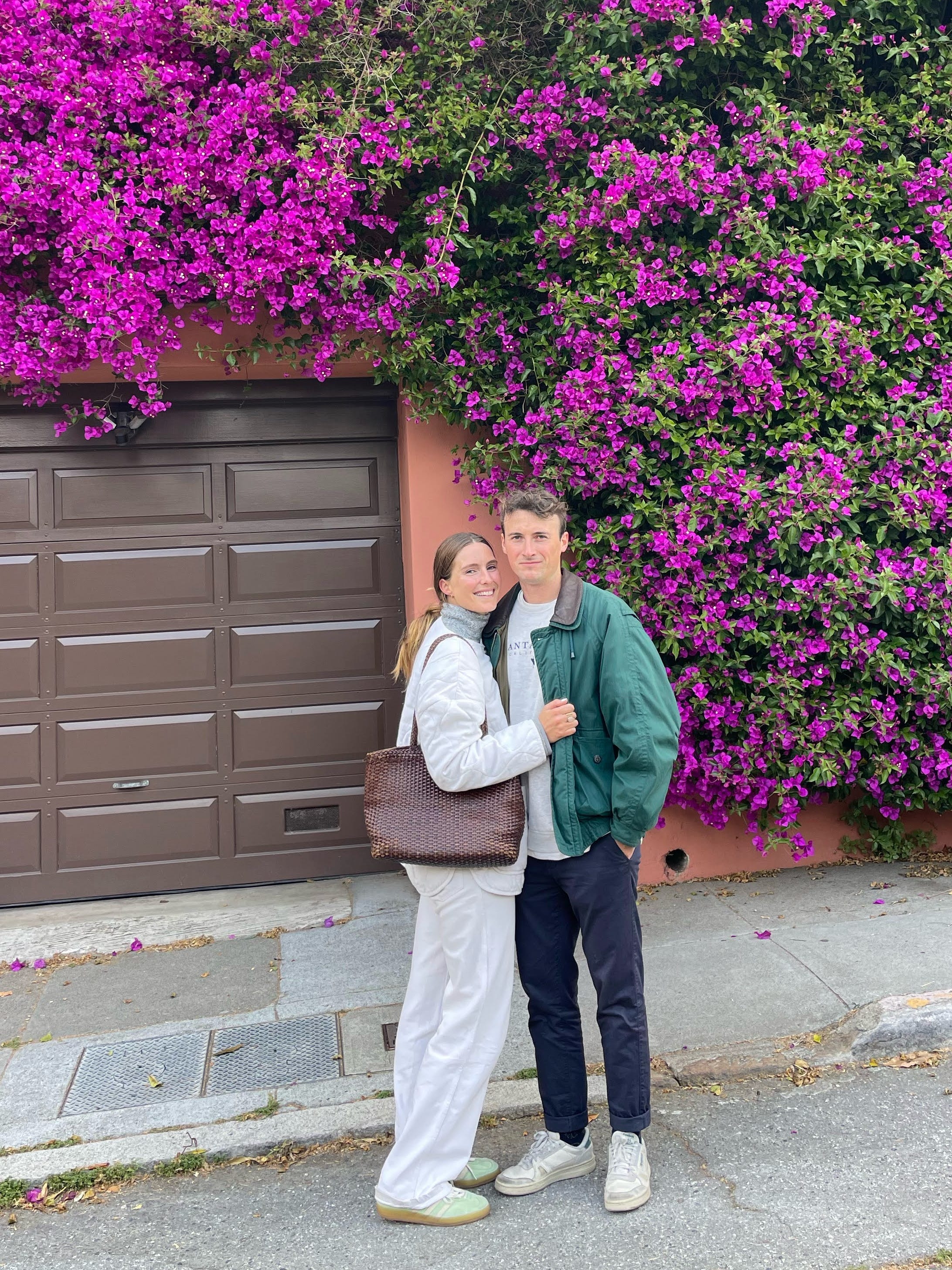Woman and man stood on a street in Spain.