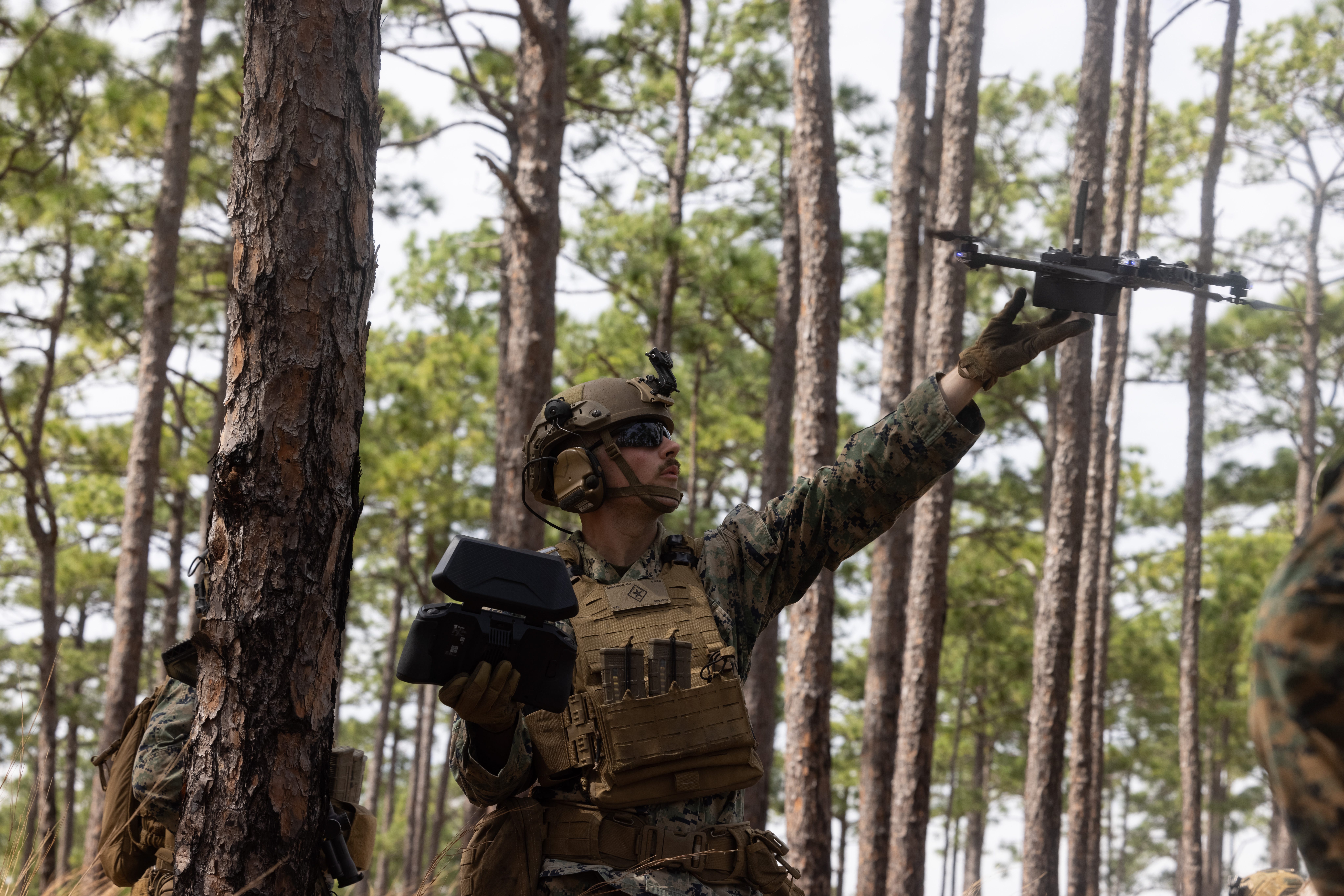 A Marine releases a drone while participating in the Super Squad Competition on Marine Corps Base Camp Lejeune, North Carolina, March 20, 2025.