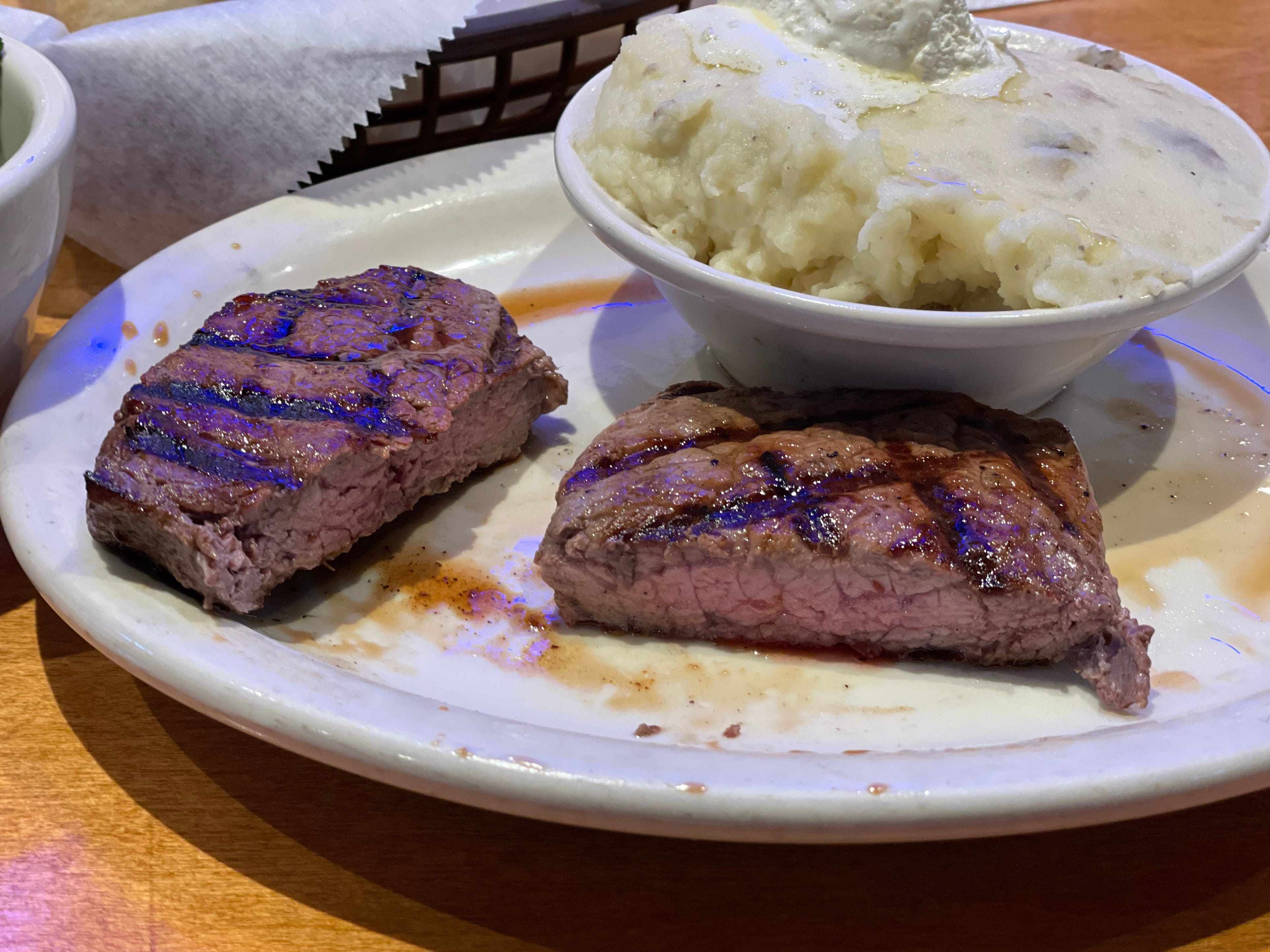 Texas Roadhouse cut in half on plate
