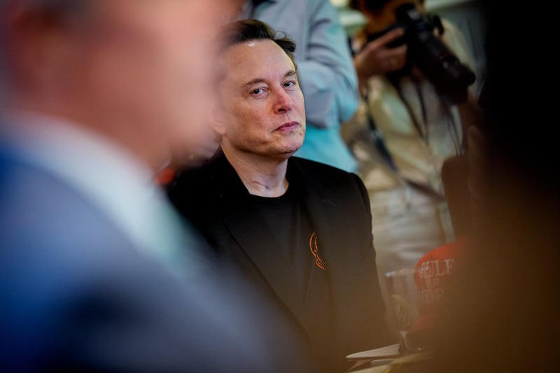 Tesla CEO Elon Musk looks on during a Cabinet meeting at the White House on April 30 in Washington, DC. Trump convened the meeting as reports show the U.S. economy contracted in the first quarter of 2025, the first negative reading in three years, fueled by a massive surge in imports ahead of the administration's expected tariffs.