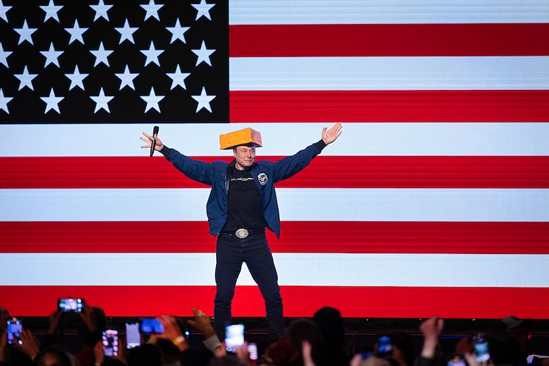 Billionaire businessman Elon Musk arrives for a town hall meeting wearing a cheesehead hat on March 30 in Green Bay, Wisconsin. The town hall was held in front of the state’s high-profile Supreme Court election.