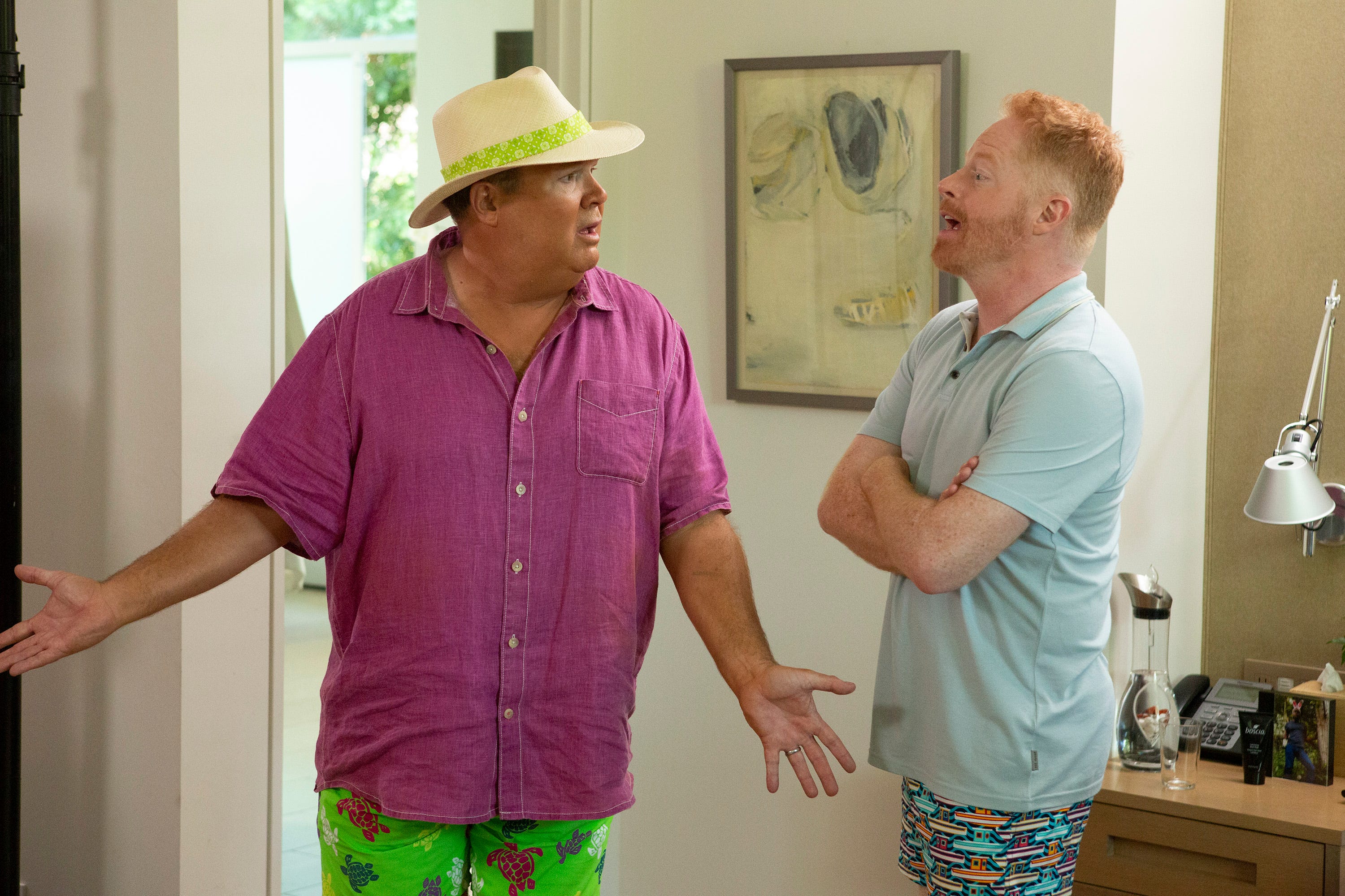 Eric Stonestreet as Cam with Jesse Tyler Ferguson as Mitchell on Modern Family.