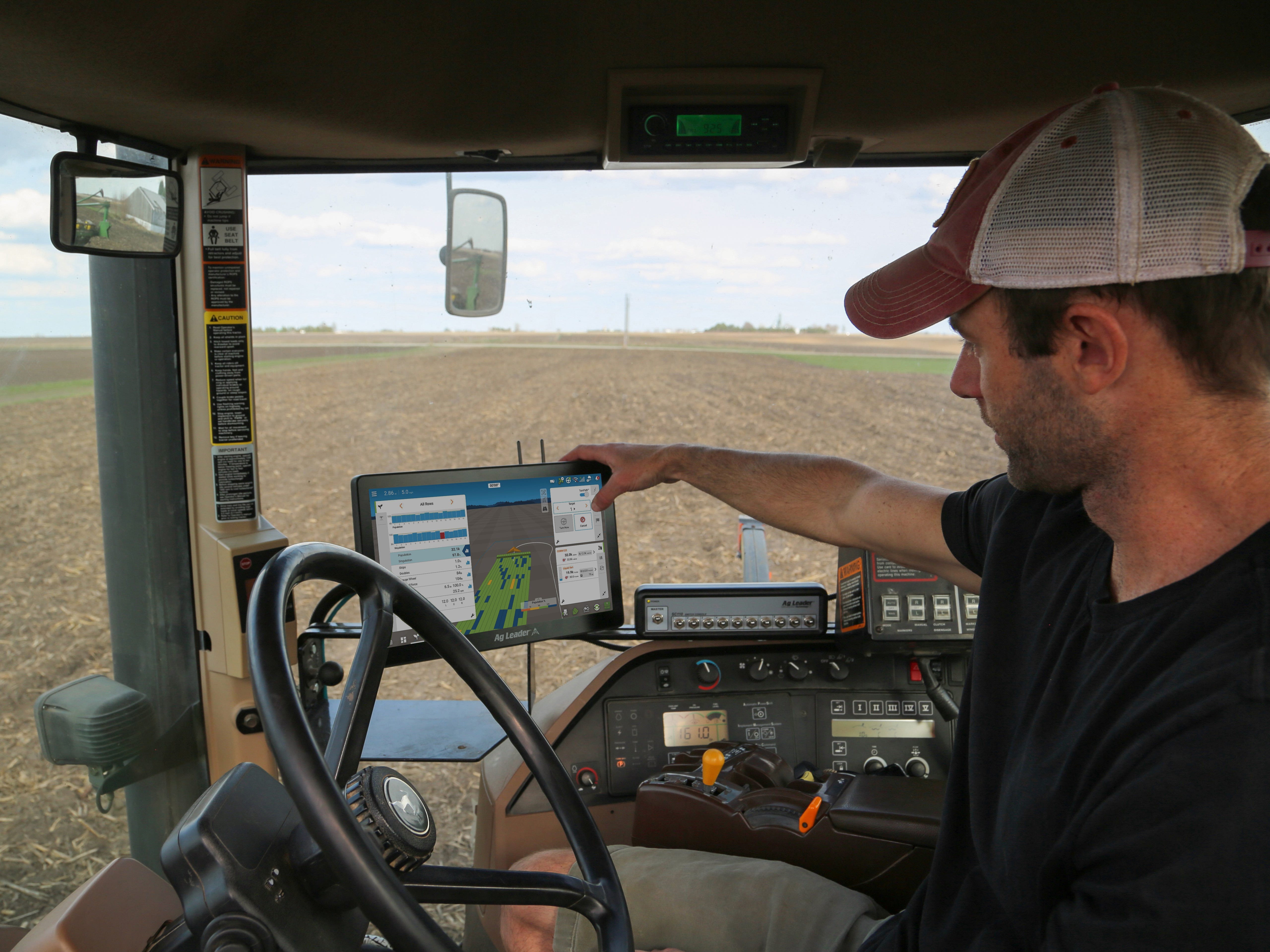 A farmer using agriculture technology from Ag Leader.