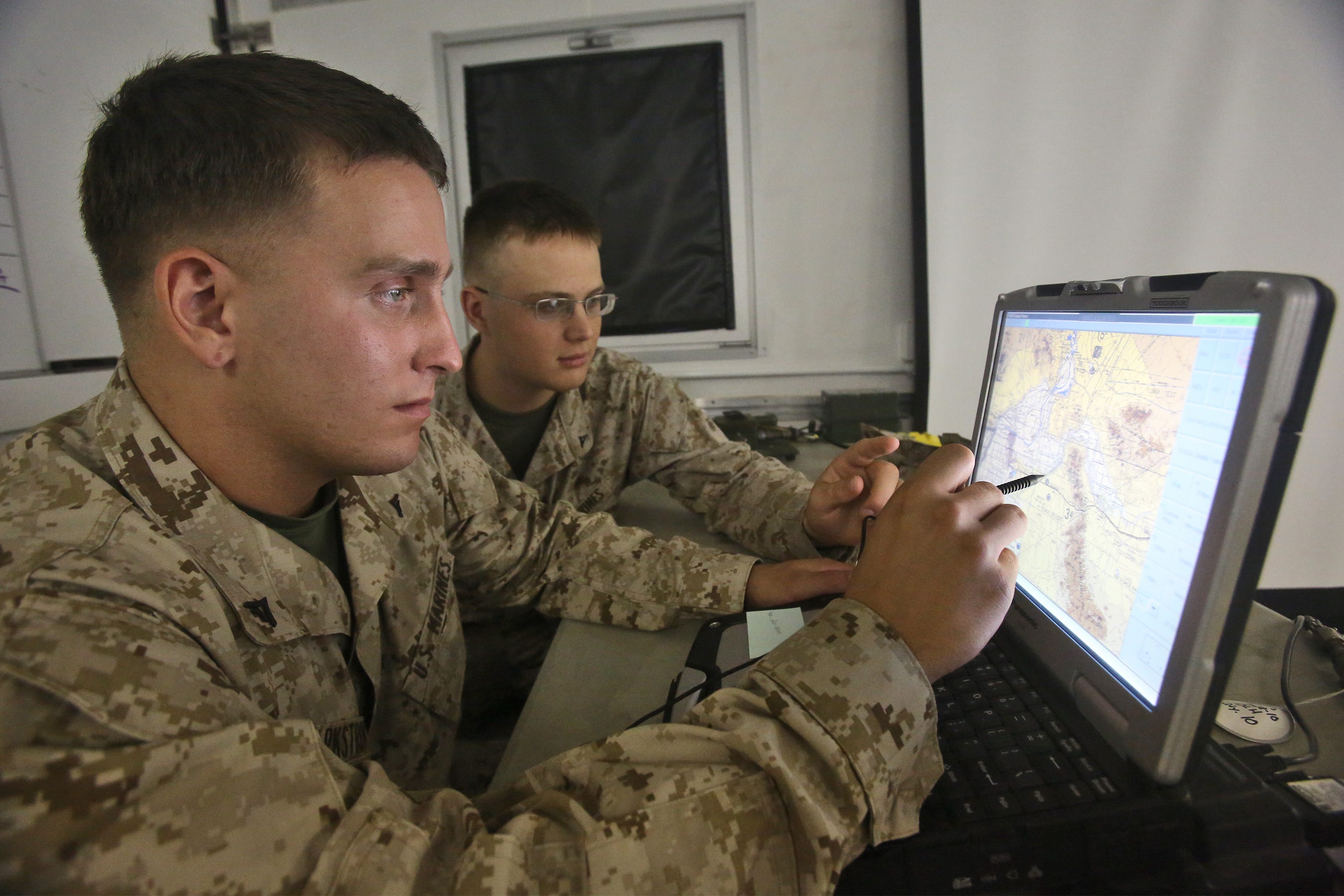 Marine data network systems technicians locate a convoy during a training event at Marine Corps Air Station Yuma, Ariz., Oct. 2, 2013.