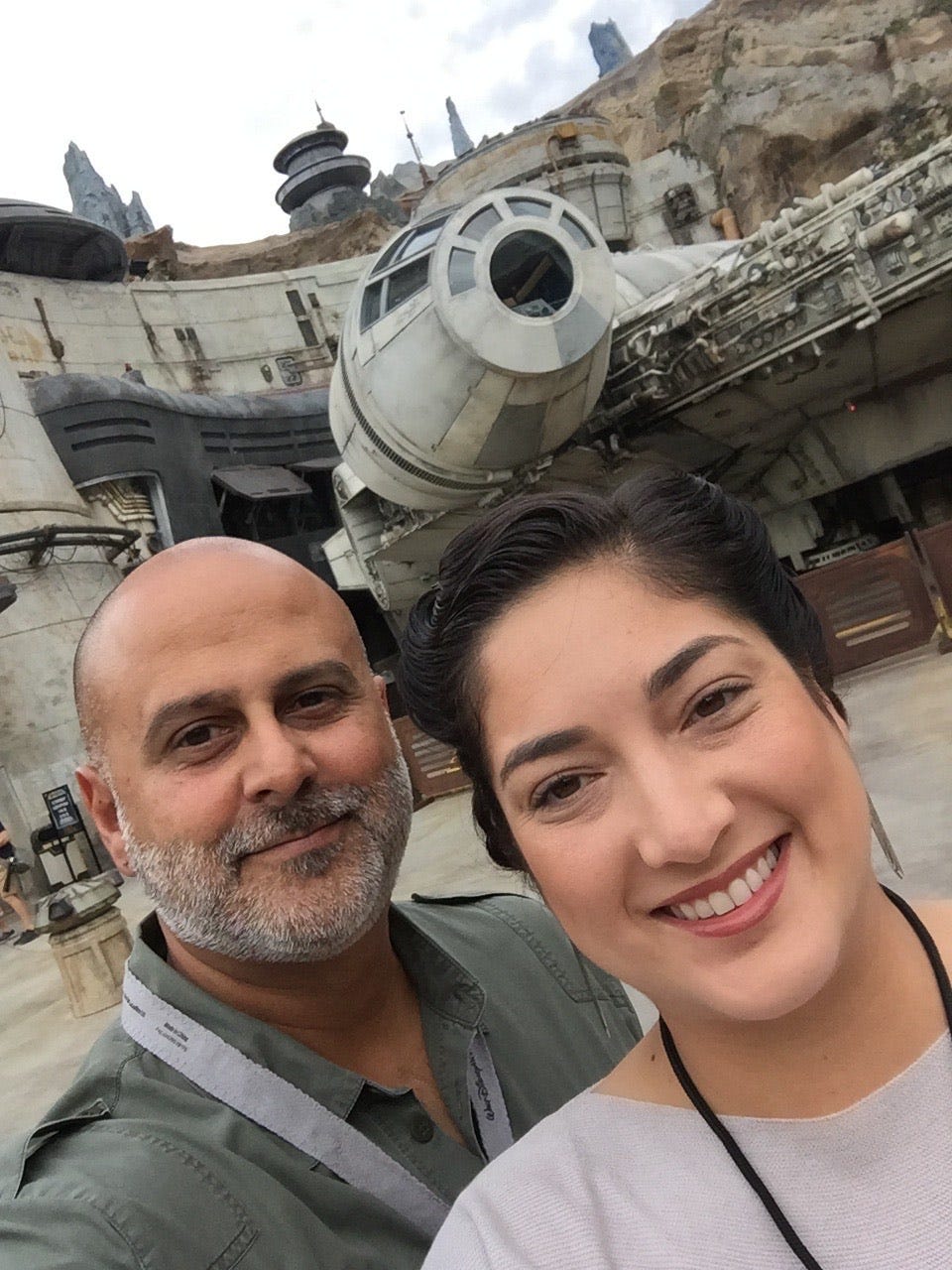 A couple posing with the Star Wars Galaxy's Edge at Disney Hollywood Studios.
