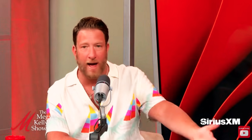 Dave Portnoy speaks into a mic. 
