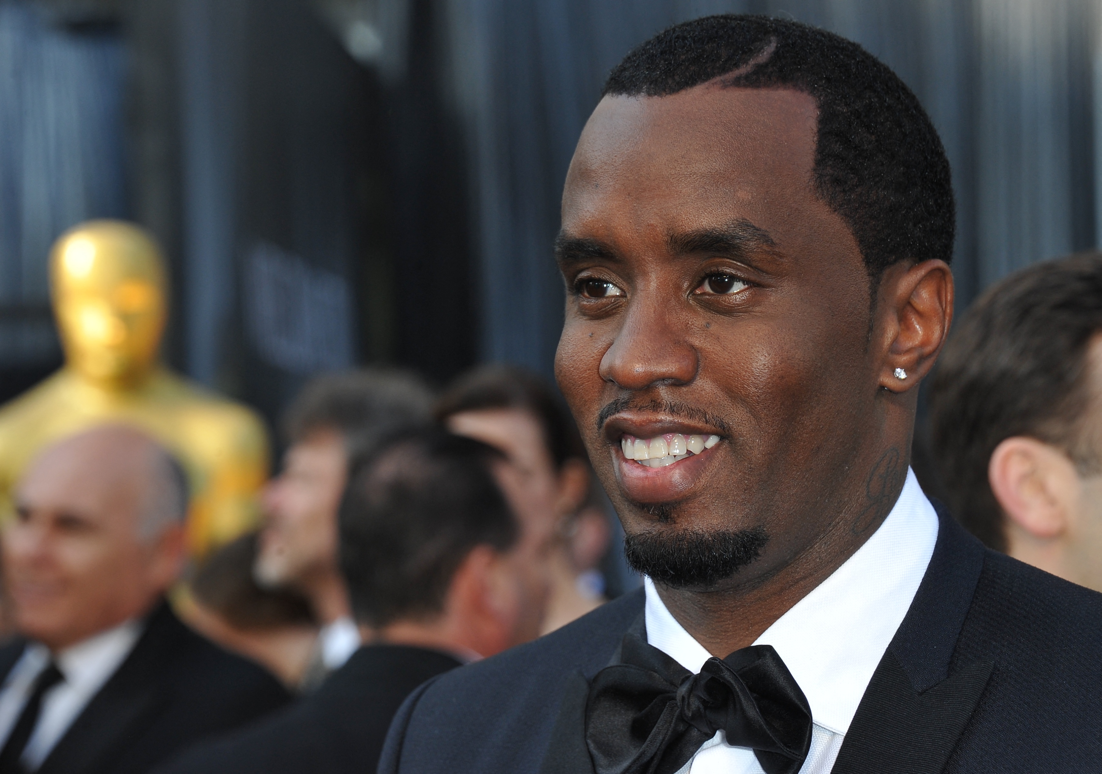 Sean Combs smiles in a tuxedo. 