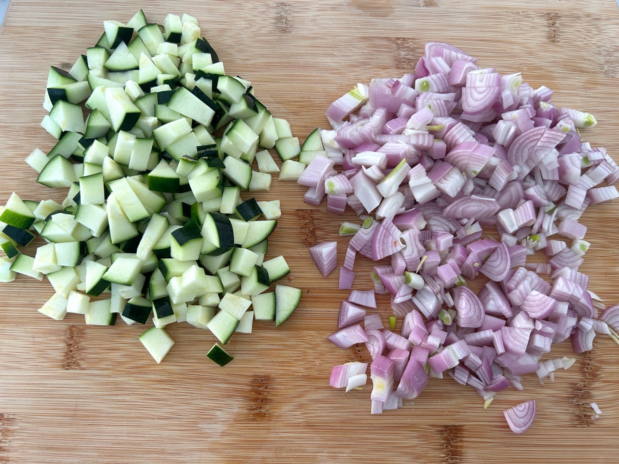 Chopped zucchini and shallots for Meghan Markle's spring garden pasta salad