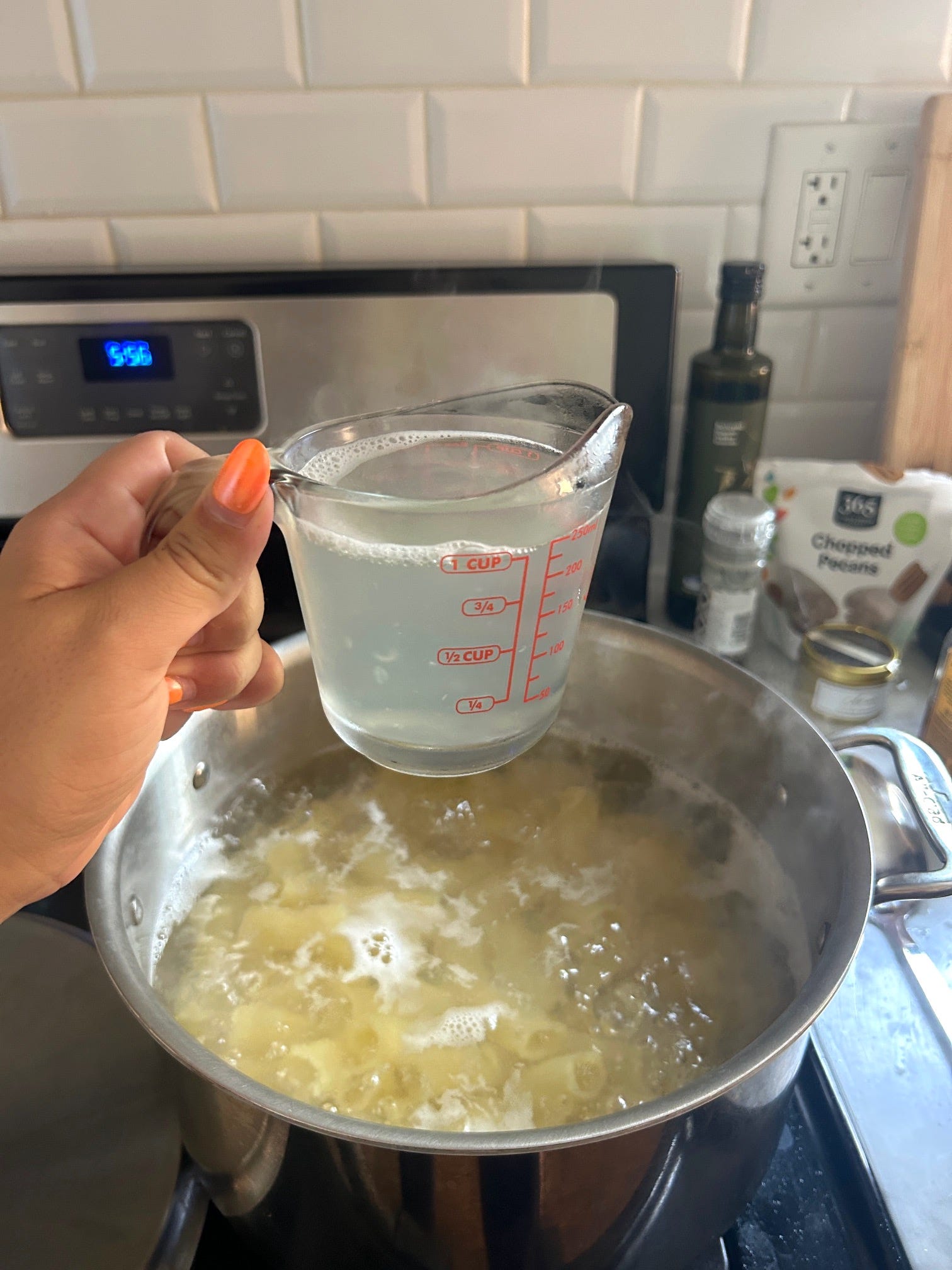 Saving pasta water for Meghan Markle's spring garden pasta salad