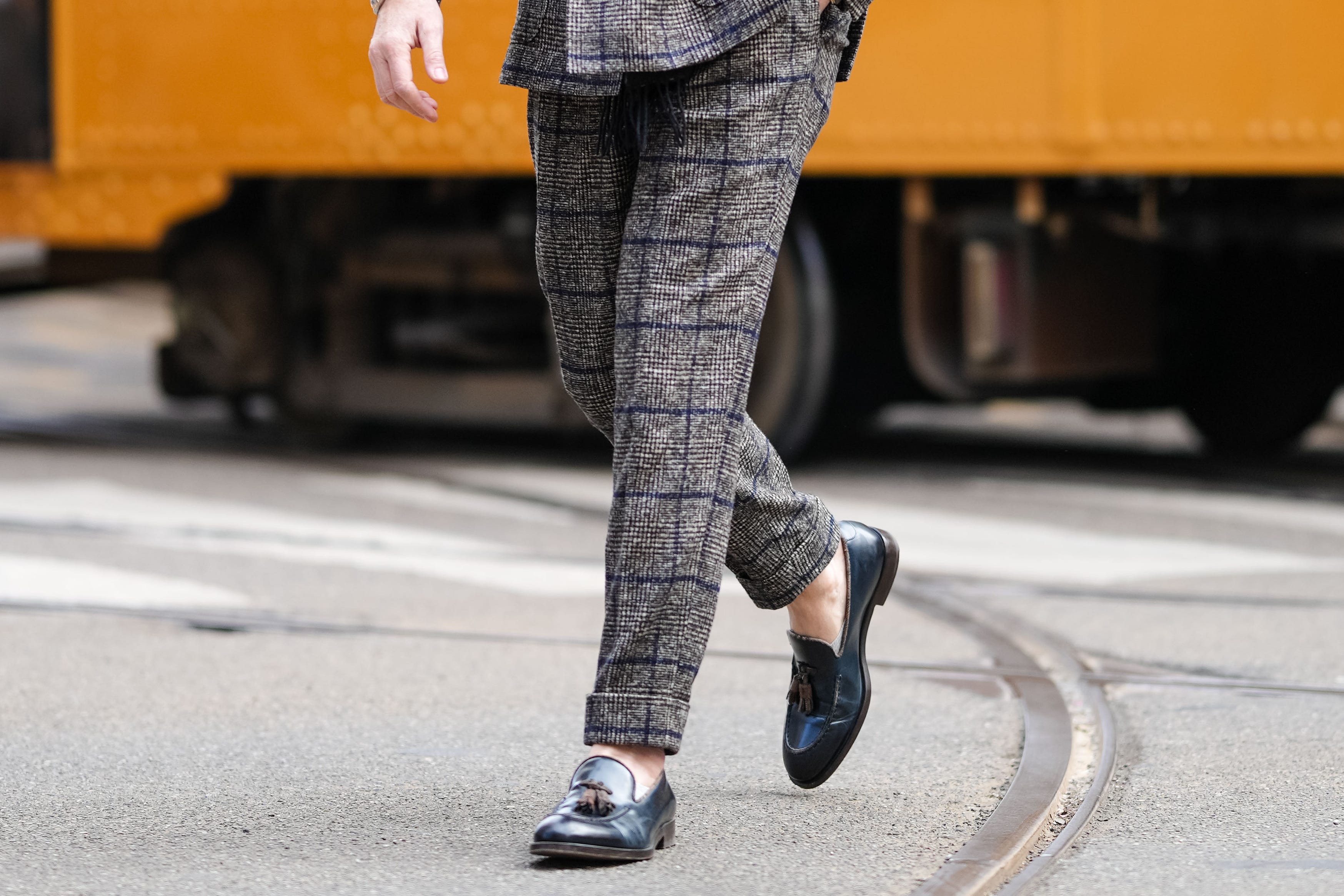 Man wearing tweed suit, loafers