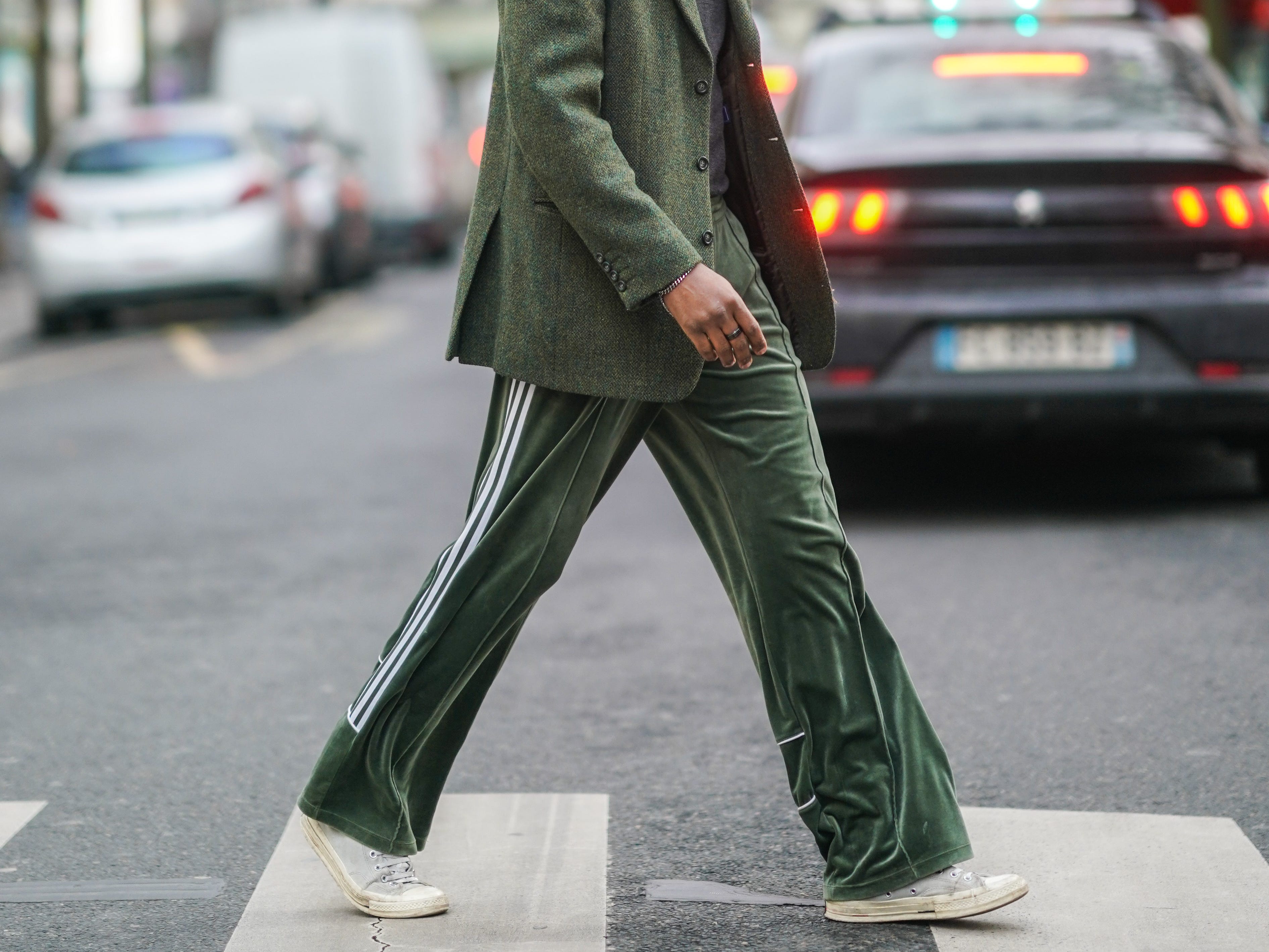 Man walking in green pants, green suit jacket