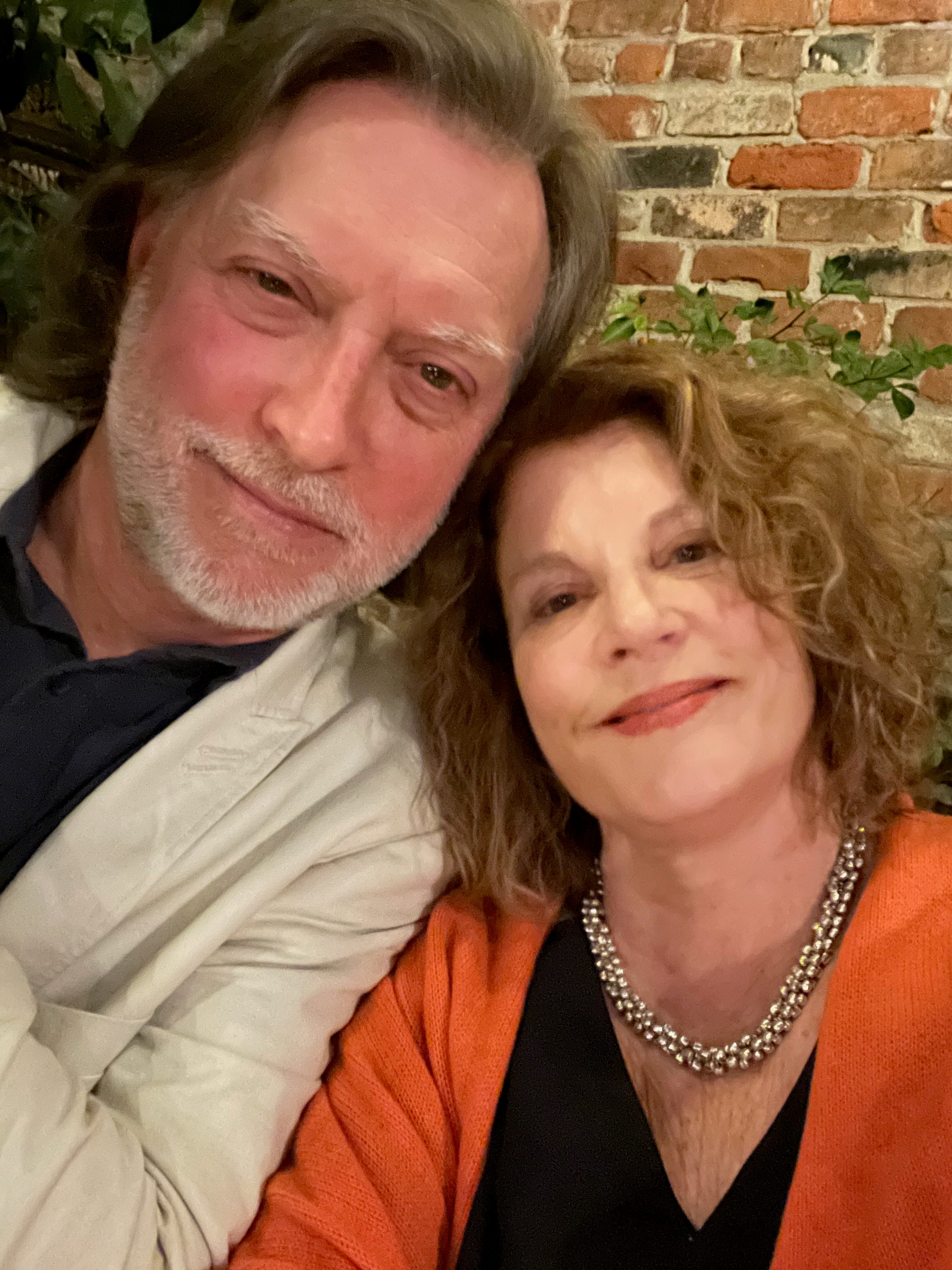 Author Robin Horton and her husband smiling