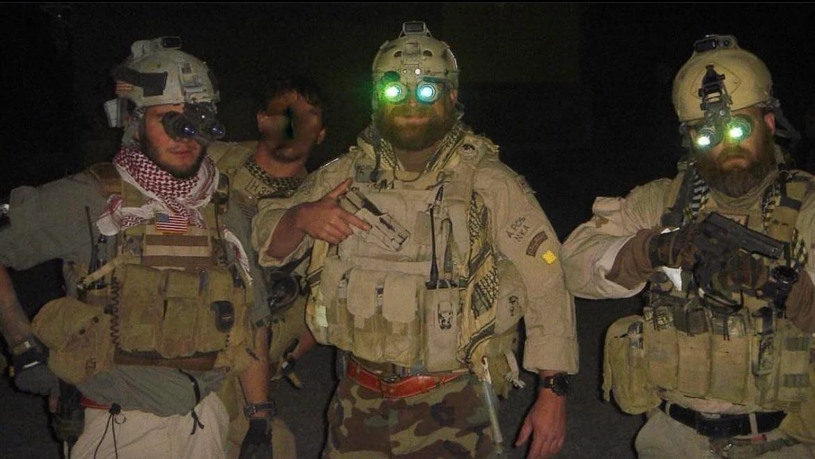 Shawn Ryan with two teammages wearing night goggles in military attire