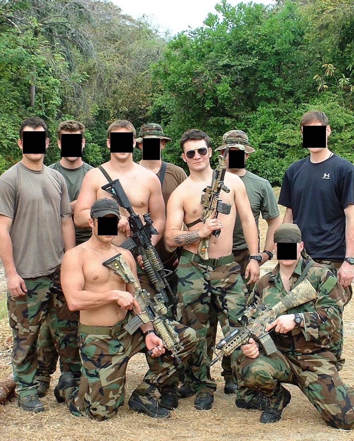 Shawn Ryan in military gear with eight of his teammates