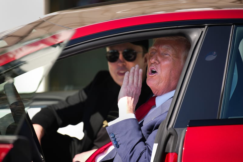 U.S. President Donald Trump and White House Senior Advisor, Tesla and SpaceX CEO Elon Musk sit in a Tesla Model S on the South Lawn of the White House on March 11, 2025 in Washington, DC.