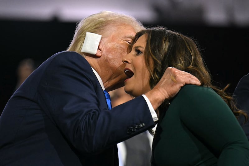 US Representative (R-NY) and House Republican Conference Chair Elise Stefanik (R) reacts next to US former President and 2024 Republican presidential candidate Donald Trump during the second day of the 2024 Republican National Convention at the Fiserv Forum in Milwaukee, Wisconsin, July 16, 2024. Days after he survived an assassination attempt Donald Trump won formal nomination as the Republican presidential candidate and picked right-wing loyalist J.D. Vance for running mate, kicking off a triumphalist party convention in the wake of last weekend's failed assassination attempt. (Photo by ANGELA WEISS / AFP) (Photo by ANGELA WEISS/AFP via Getty Images)
