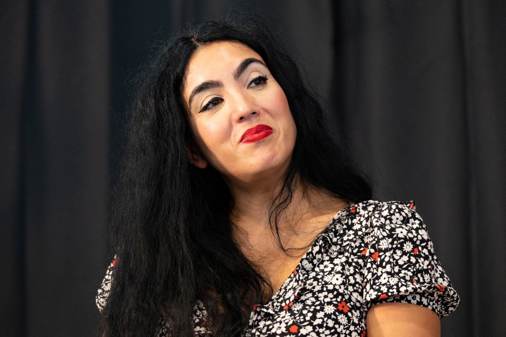 Gisele Barreto Fetterman listens to her husband Pennsylvania Lieutenant Governor and U.S. Senate candidate John Fetterman speak during a rally in Philadelphia, Pennsylvania, U.S., September 24, 2022.  