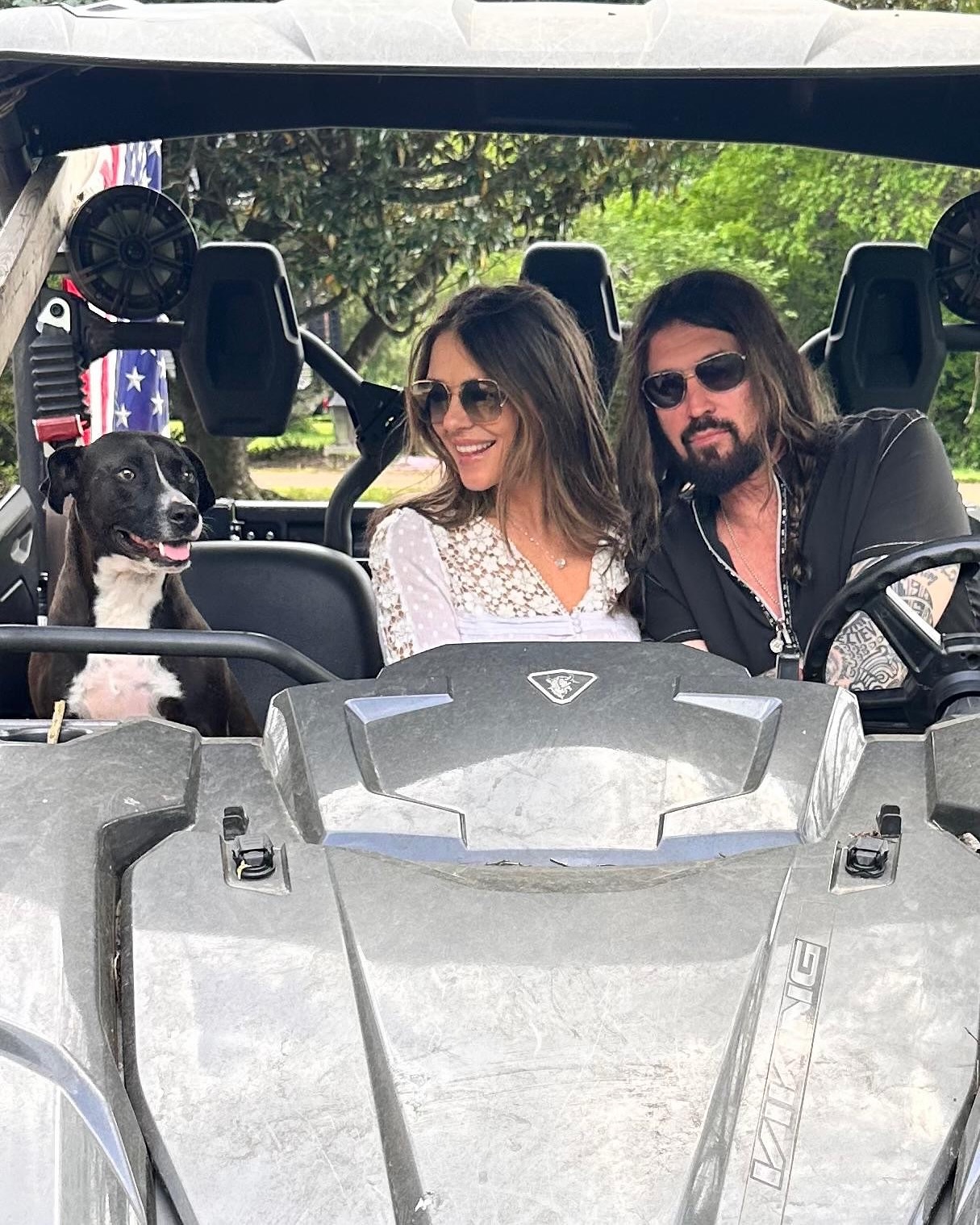 Elizabeth Hurley and Billy Ray Cyrus in an informal photo. 