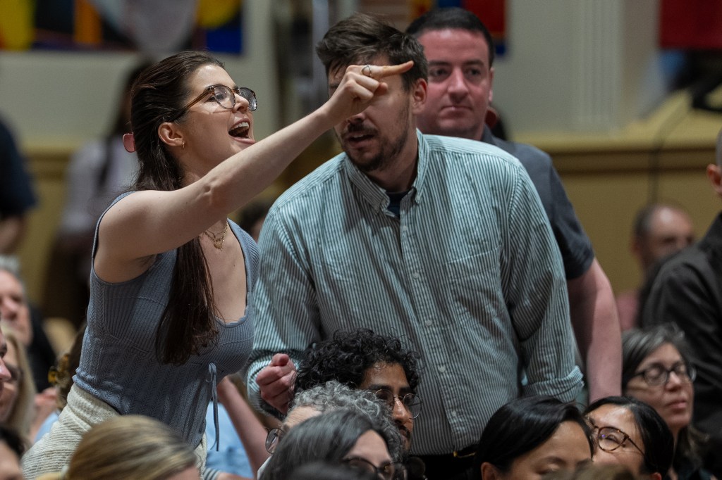 An attendee shouts at Rep. Alexandria Ocasio-Cortez (D-NY) during a town hall gathering about her stance on the Israel / Palestine conflict on May 2, 2025 in New York City.