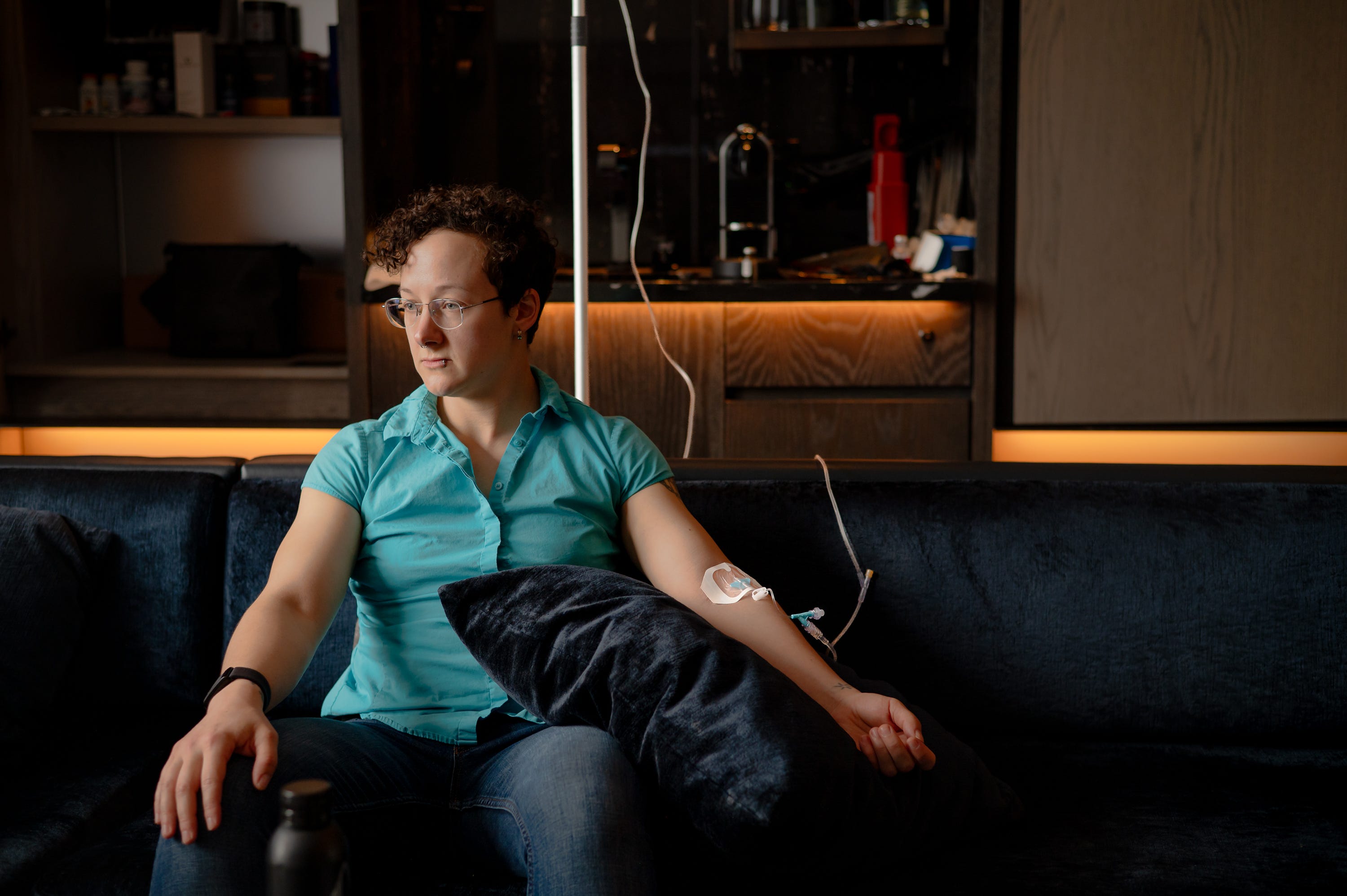 Reporter sits hooked to an NAD IV.