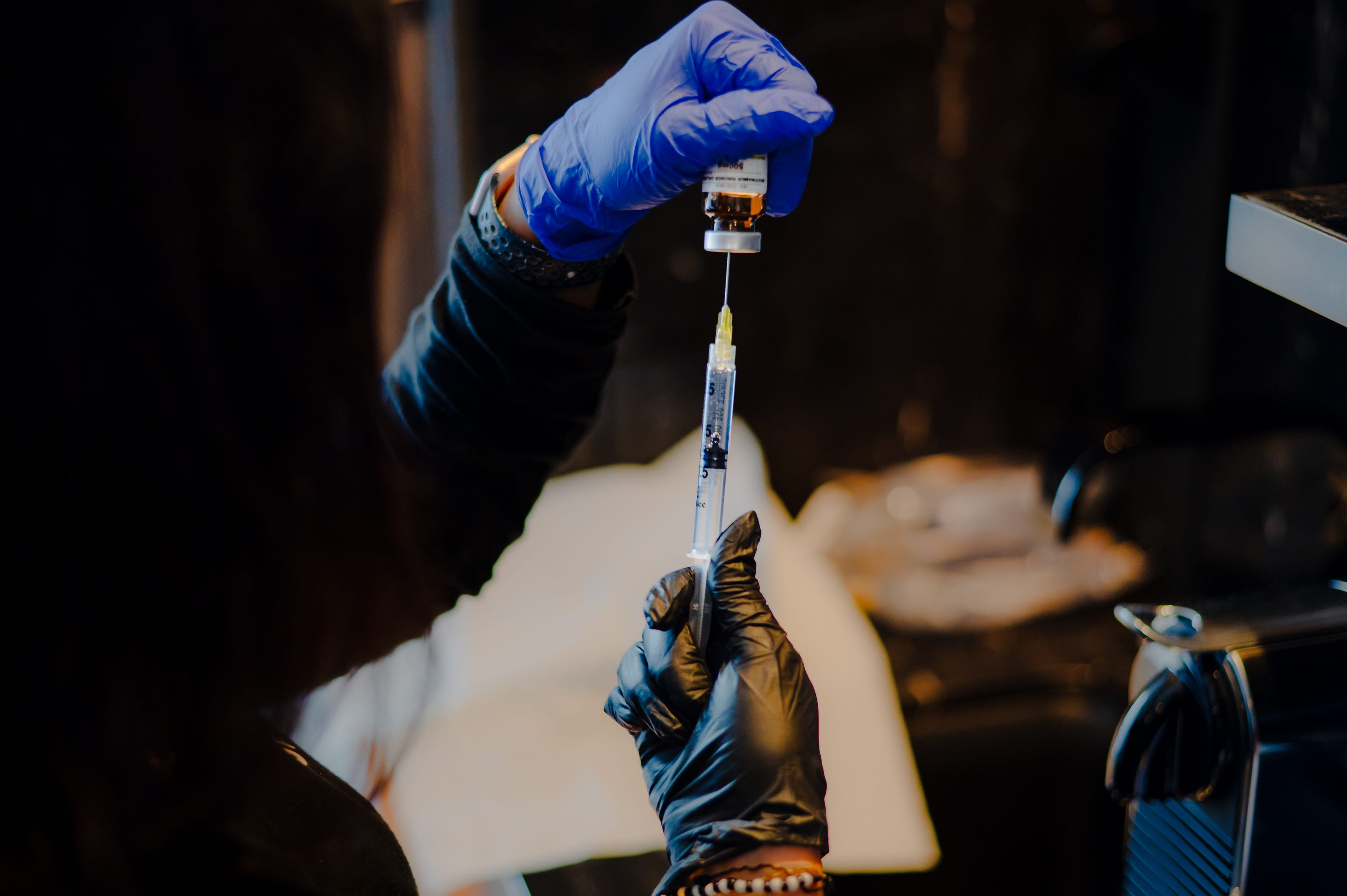 NAD supplement being administered through a syringe.